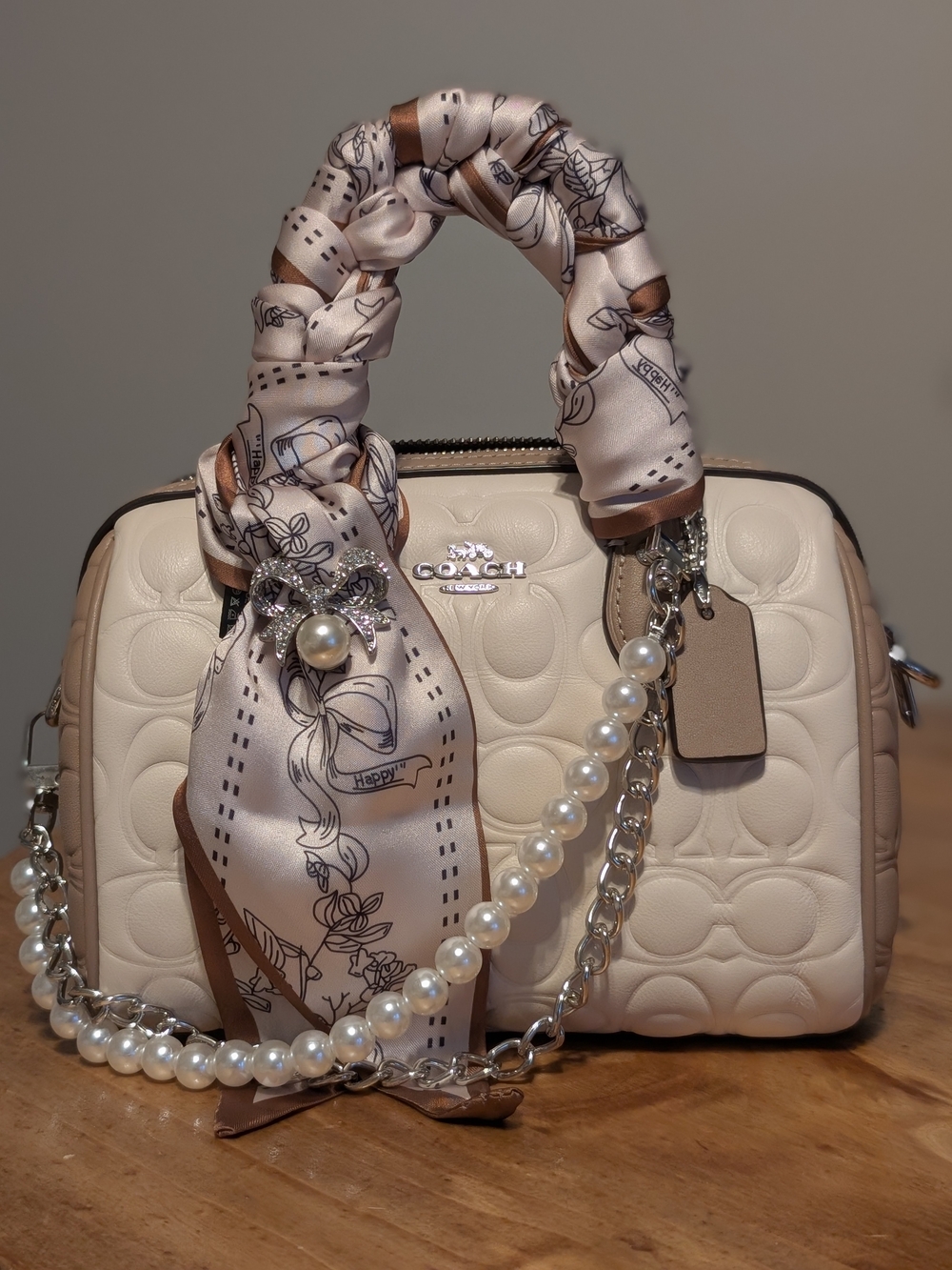Coach Mini Rowan Crossbody Bag in Blocked Signature Embossed Leather Chalk/Taupe